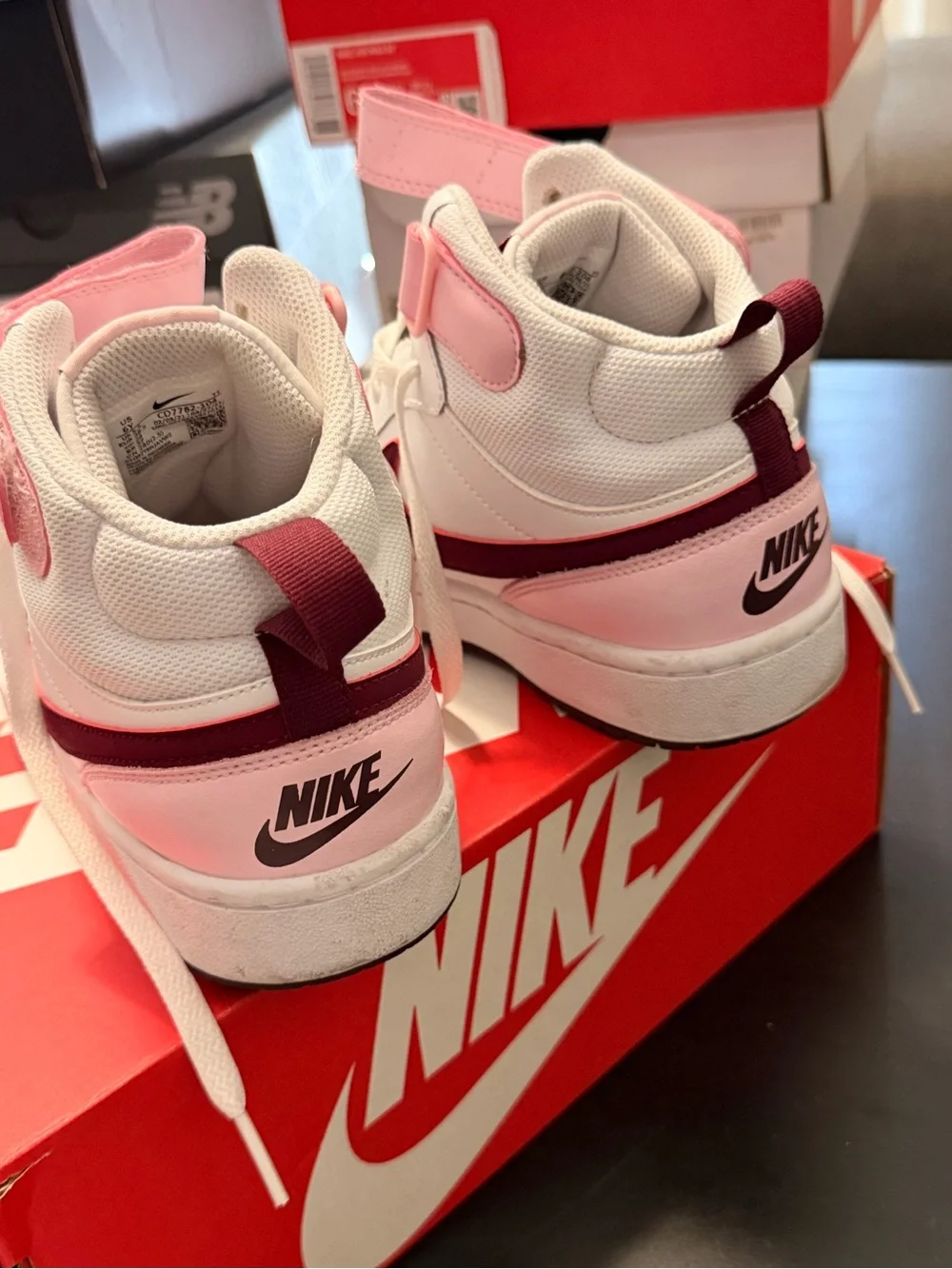Nike White High-Top Sneakers with Pink Strap and Maroon Swoosh